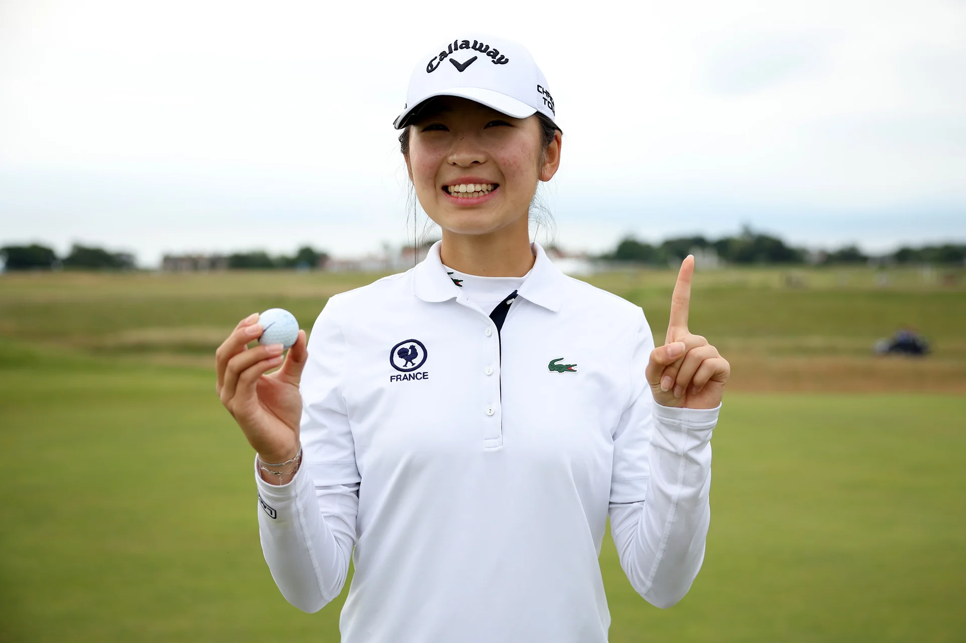 Giselle Zhao of France poses after her hole in one on the 4th hole during Day one of the 2026 Women's Amateur Championship at Muirfield.