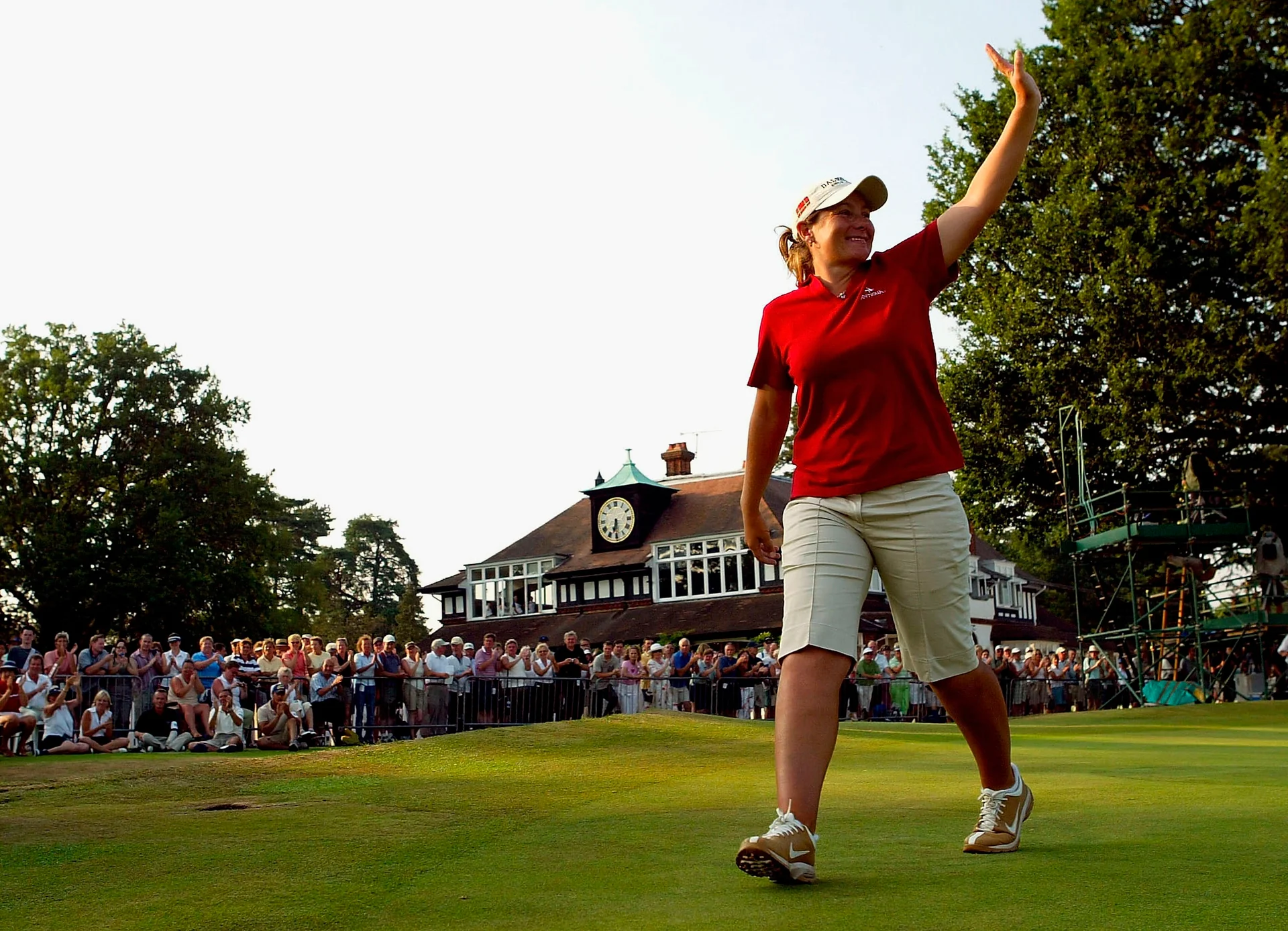 Karen Stupples of England acknowledges the crowd after winning the Women's Open with a score of 19 under par, at Sunningdale Golf Club.