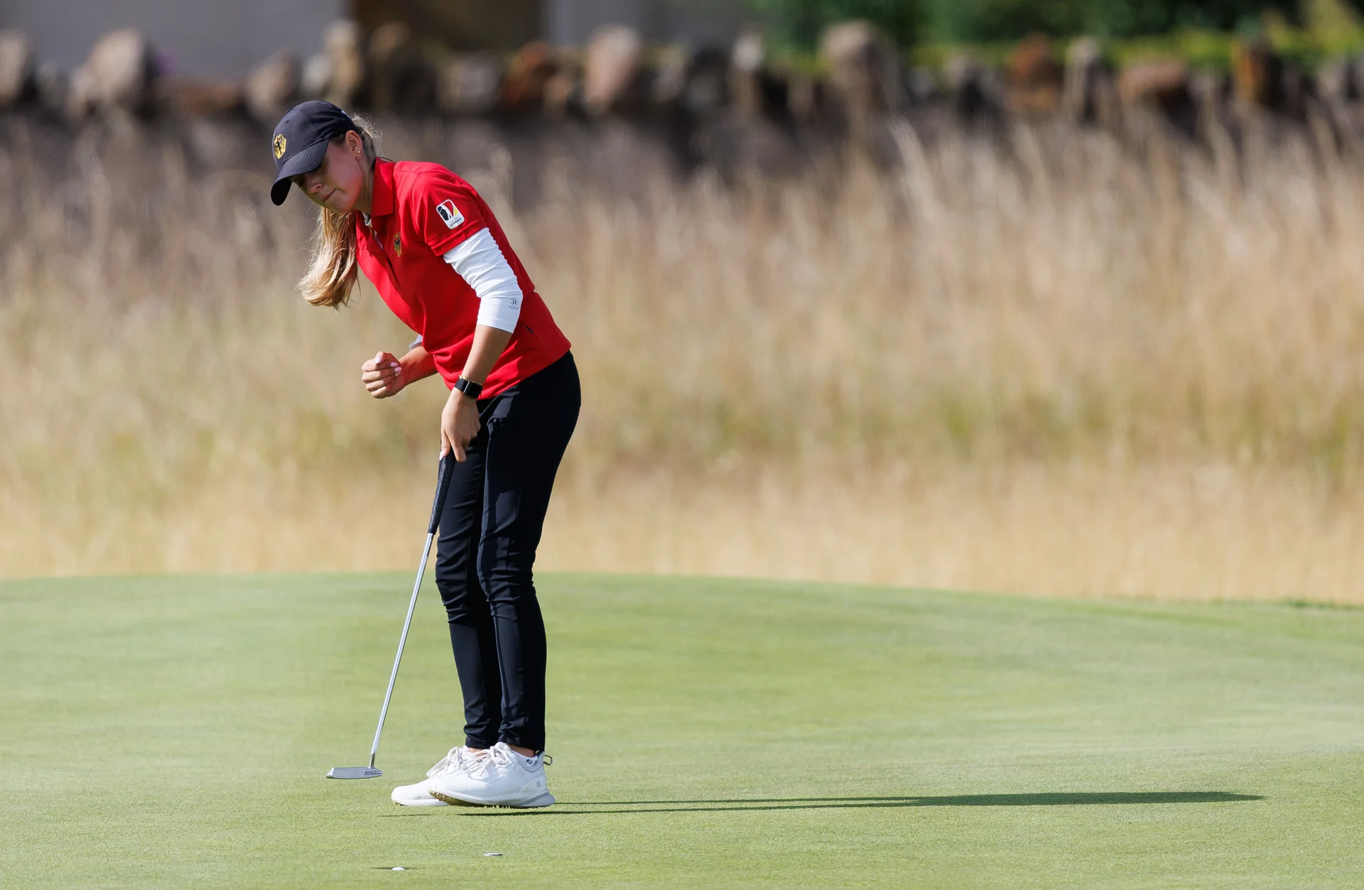 Lena Geier of Germany celebrates holing a putt at the 10th green during Day Two of the R&A Girls' Amateur Championship.