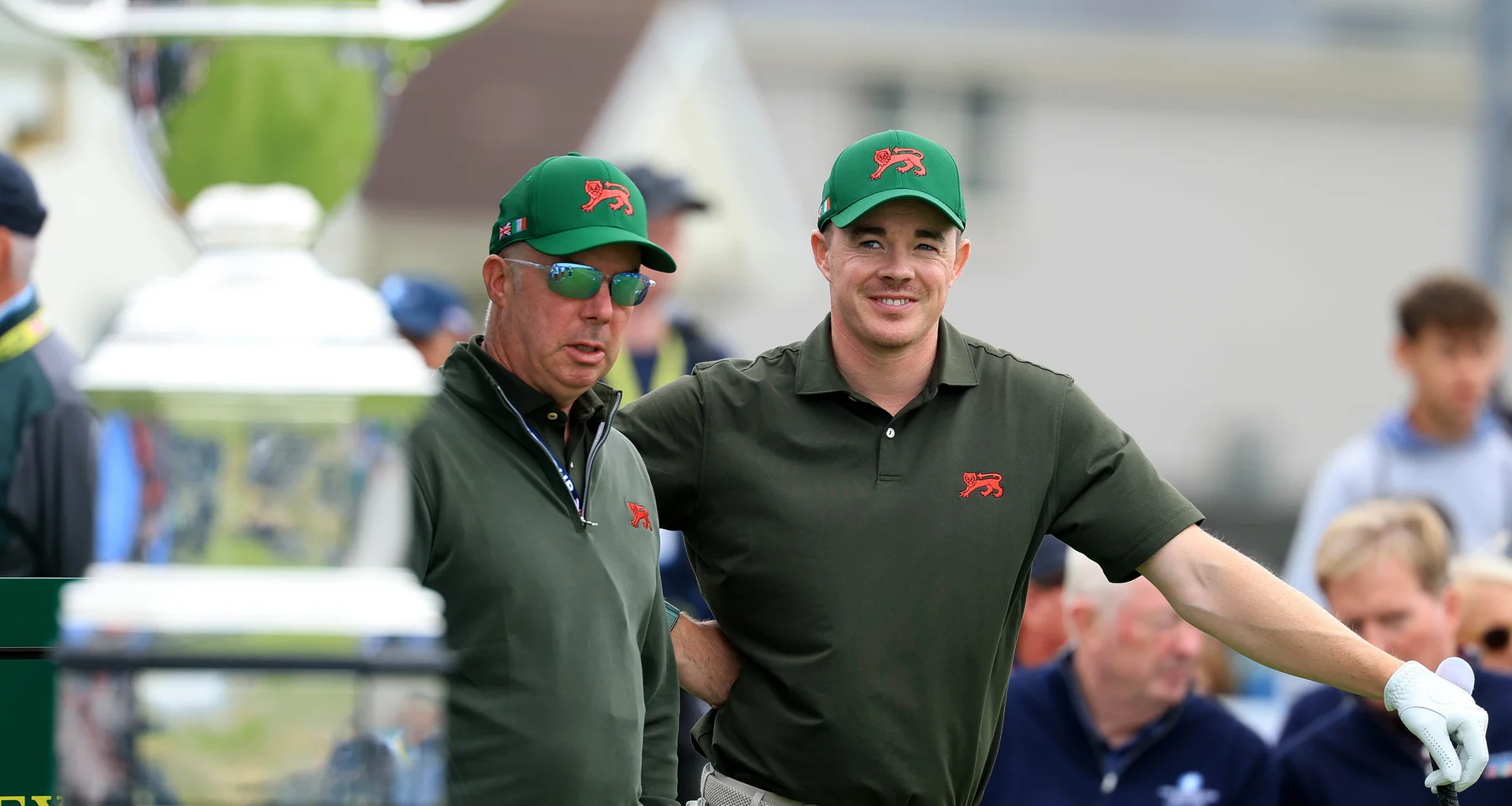 Stuart Grehan of the Great Britain and Ireland team waits to tee off on the first hole with his captain Dean Robertson in his match against Preston Stout of The United States team during the afternoon singles matches on day one of the Walker Cup at Lahinch.