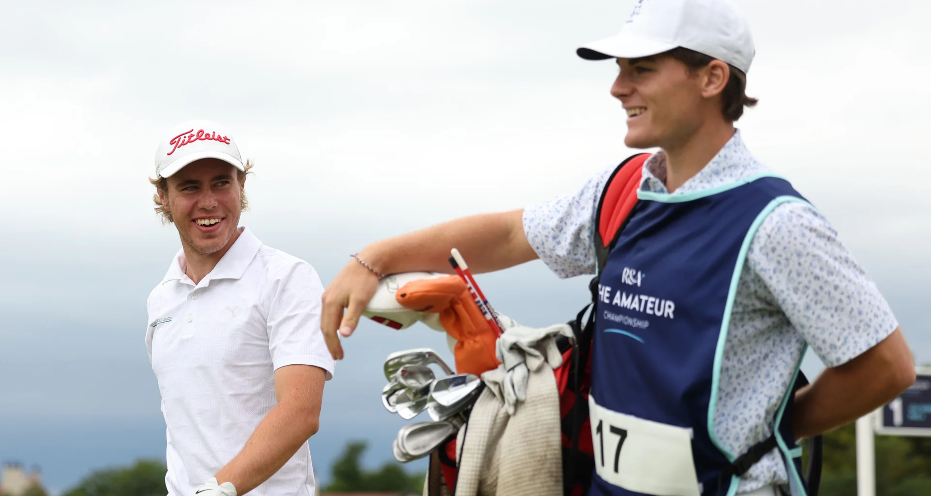 Oscar Valdemar Holm Bredkjær shares a joke with his caddie during The 131st Amateur Championship.
