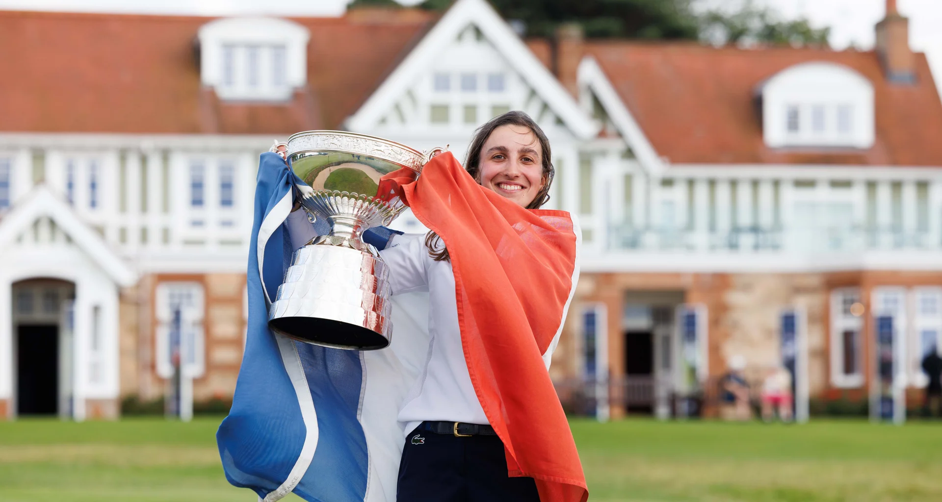 Valentine Delon of France poses with the trophy following her victory during the Final of the 2026 Women's Amateur Championship at Muirfield.