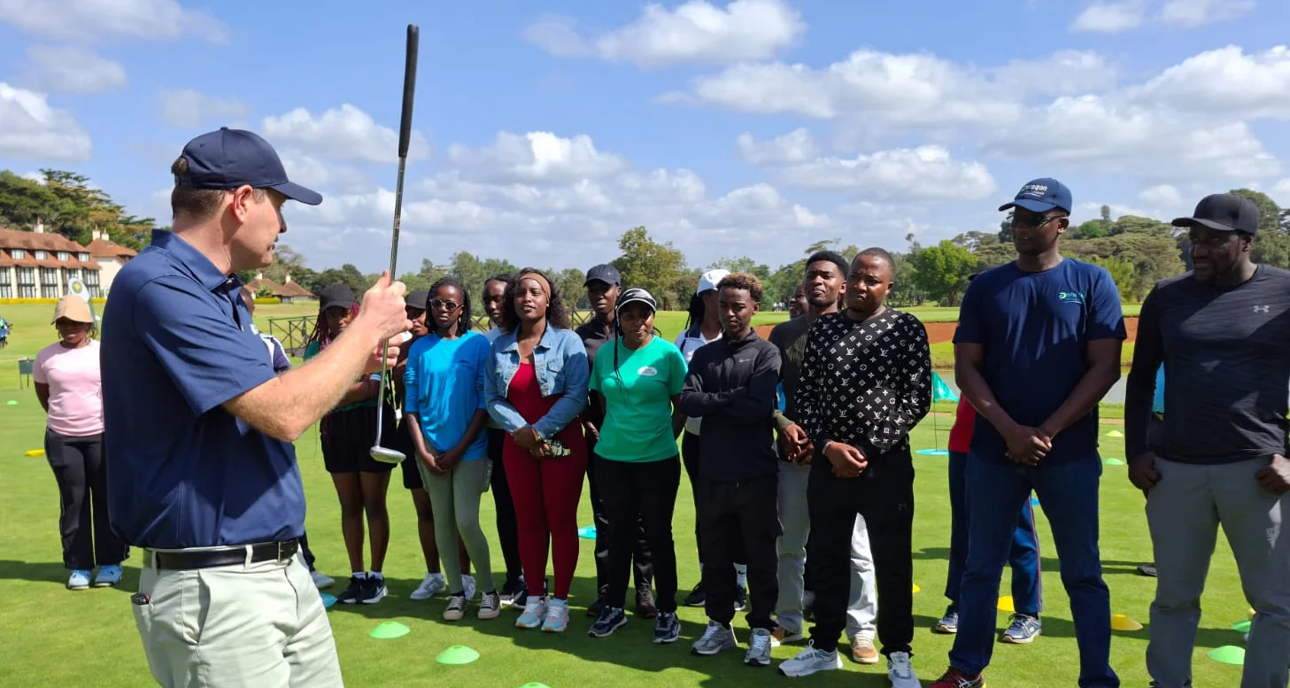 A golf coach from The R&A leads a training session in Africa.