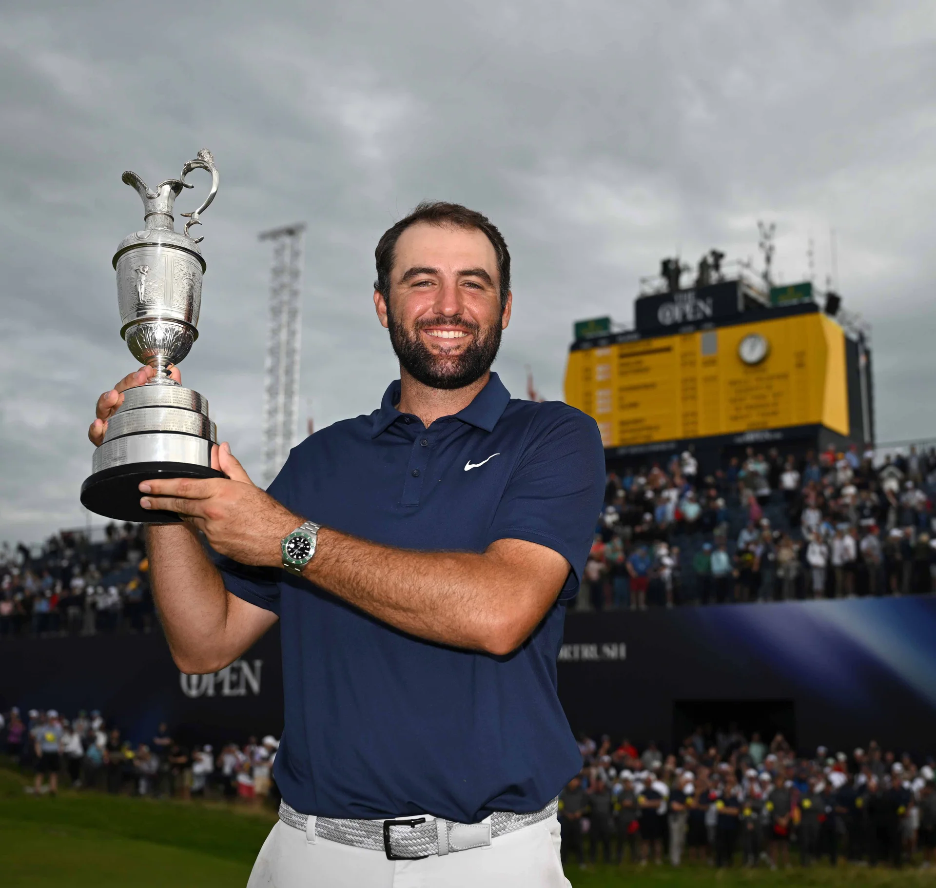 Scottie Scheffler holds the Claret Jug aloft after winning The 153rd Open at Royal Portrush.