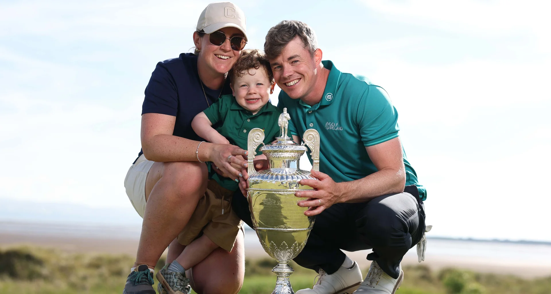 Stuart Grehan celebrates his win at The 131st Amateur Championship with his wife, Carla and son, Kai.