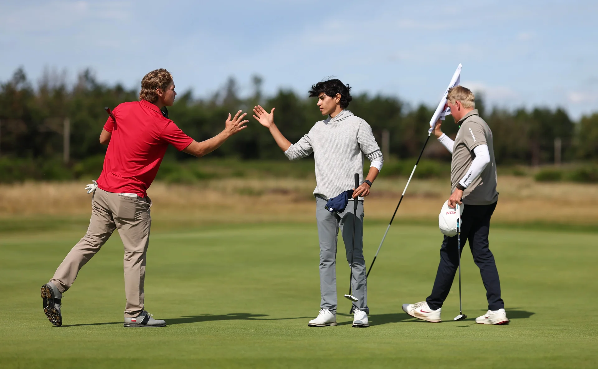 Antoni Hawkins of Poland shakes hands with Giampaolo Gagliardi of Italy during day two of The R&A Boys' Amateur Championship.