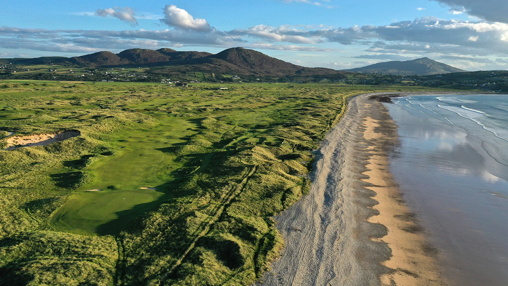 An aerial view of the par 4, 13th hole (L) and the par 5, 14th hole on The Old Links at Ballyliffin Golf Club on September 05, 2023 in Donegal, Ireland.