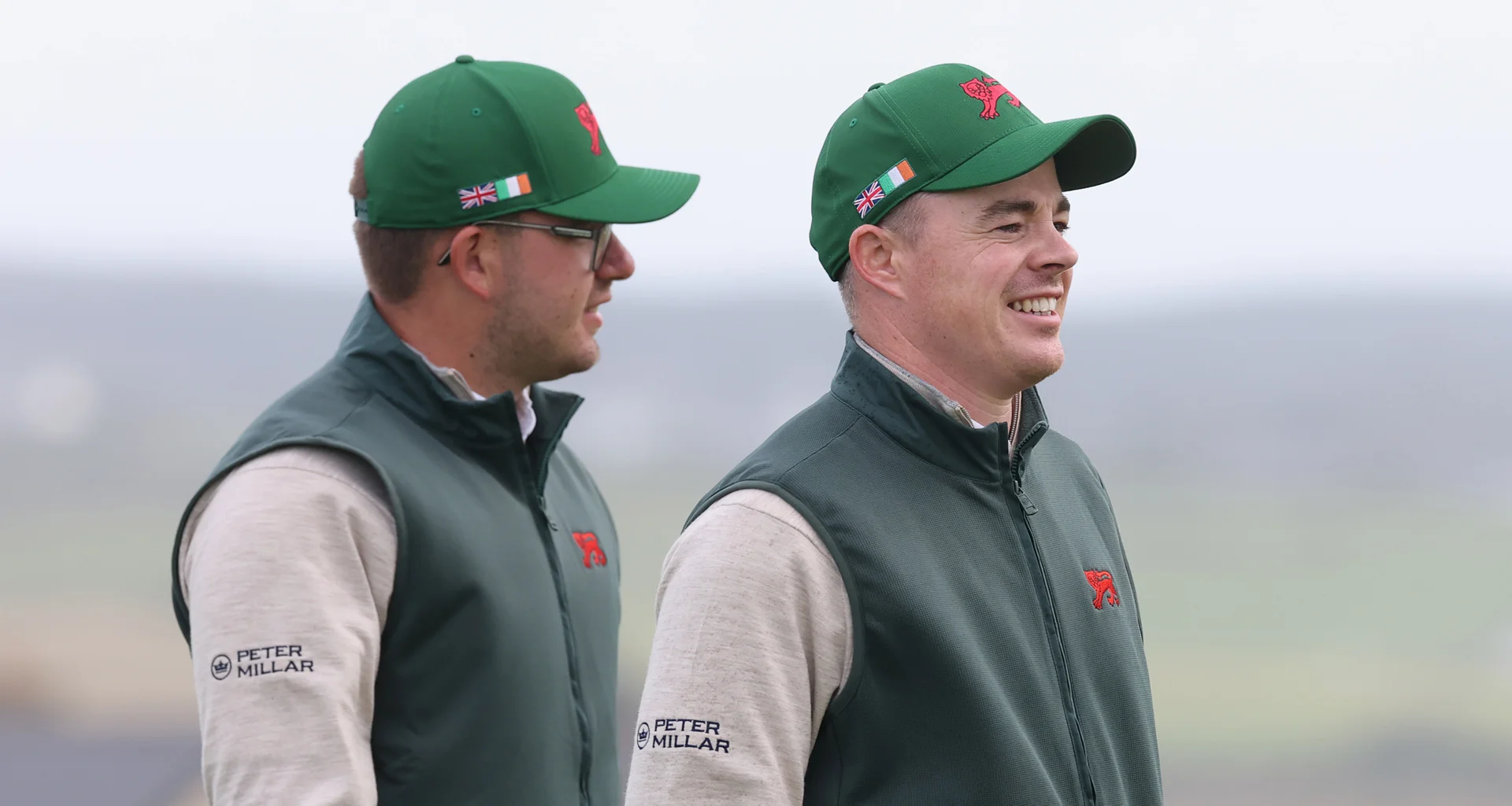 Eliot Baker walks behind Stuart Grehan wearing Team Great Britain and Ireland kit ahead of the 51st Walker Cup.