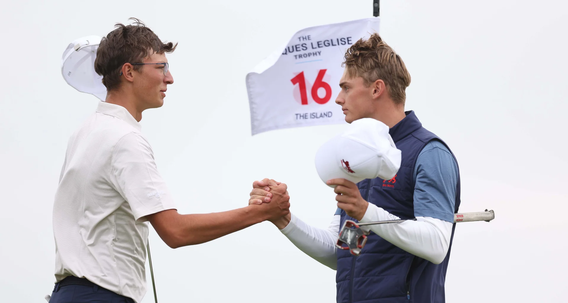 Vaclav Svub and Adam Fahey shake hands during the 2026 Jacques Leglise Trophy at The Island, Ireland.