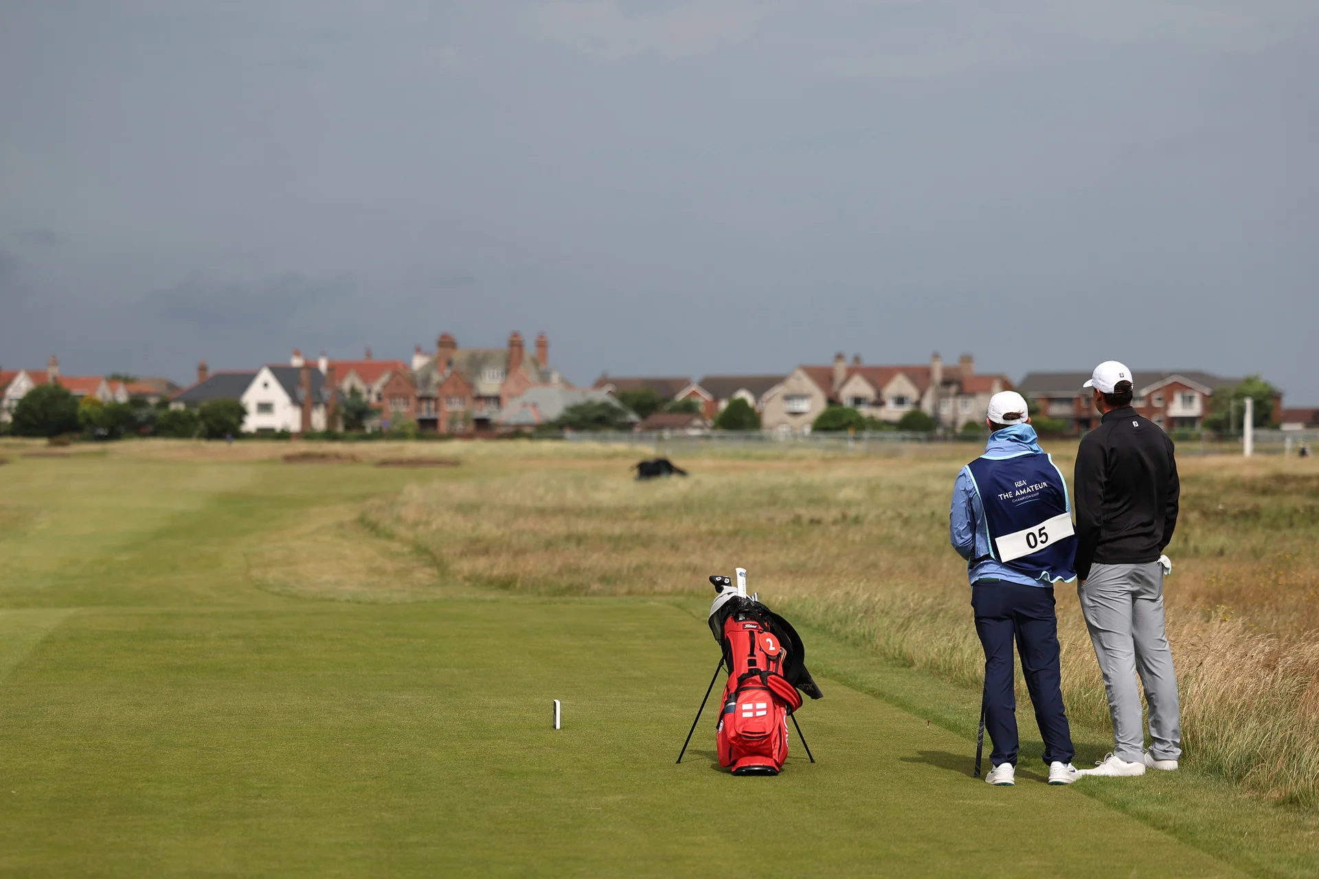 Mark Stockdale of England looks on with his caddie during Day One of the 2026 Amateur Championship at Royal Liverpool Golf Club.