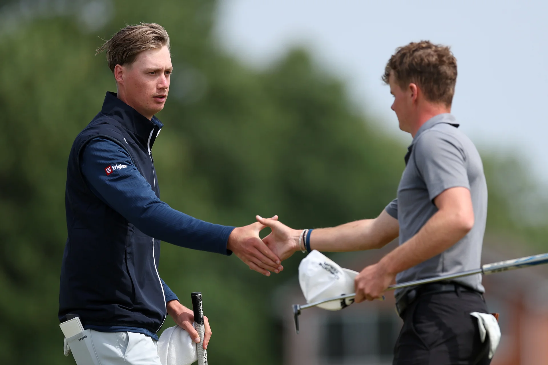 Leon Car of Slovenia shakes hands with Morgan Blythe of England during Day One of the 2026 Amateur Championship at Royal Liverpool Golf Club.
