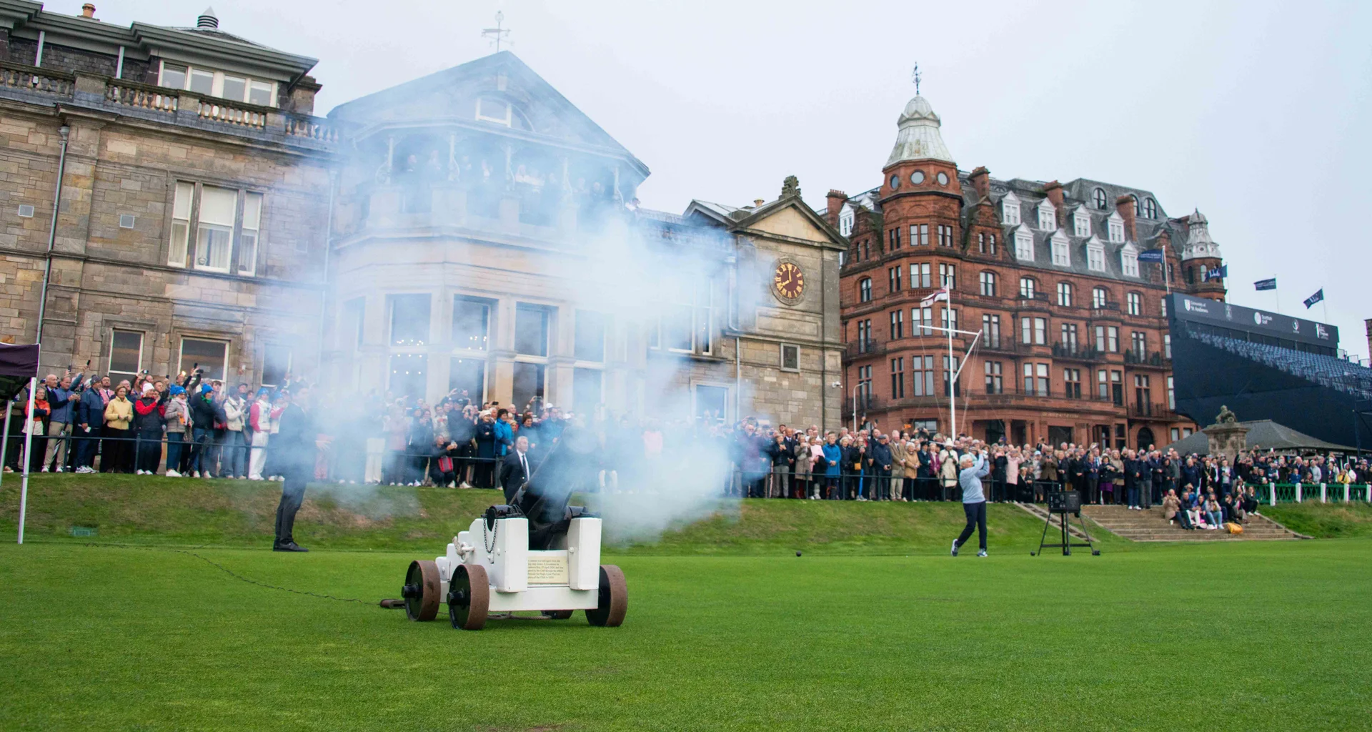 Claire Dowling hits her first tee shot as captain of The Royal and Ancient Club of St Andrews as a crowd of people watch on.