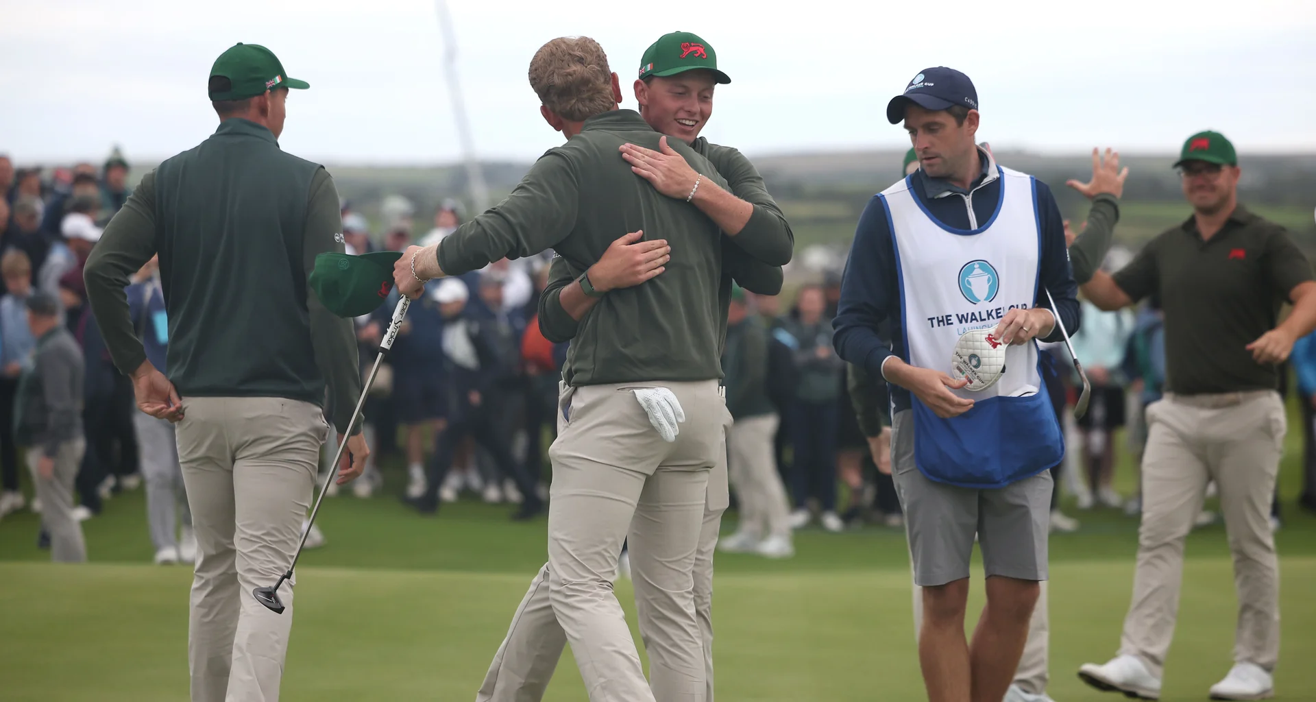 Players from Team GB&I celebrate winning a match.