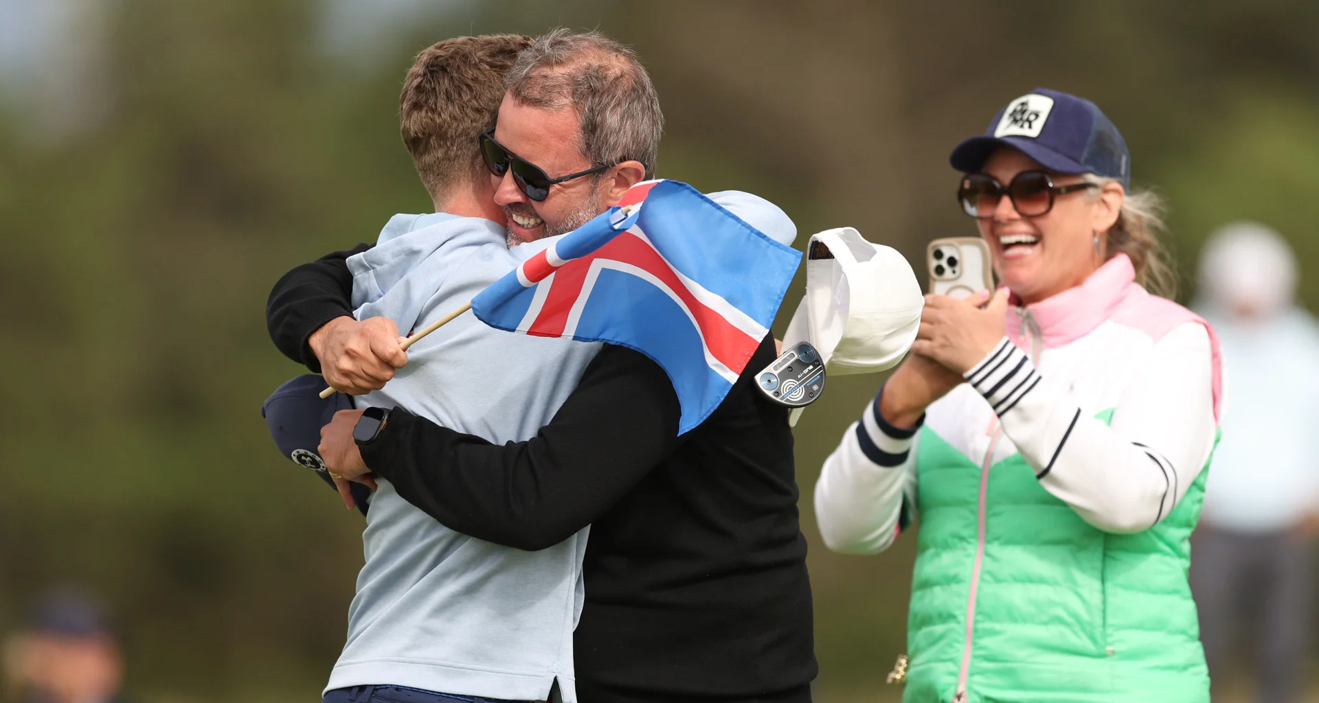 Oliver Eli Bjornsson celebrates with family after winning the Boys' Amateur Championship.