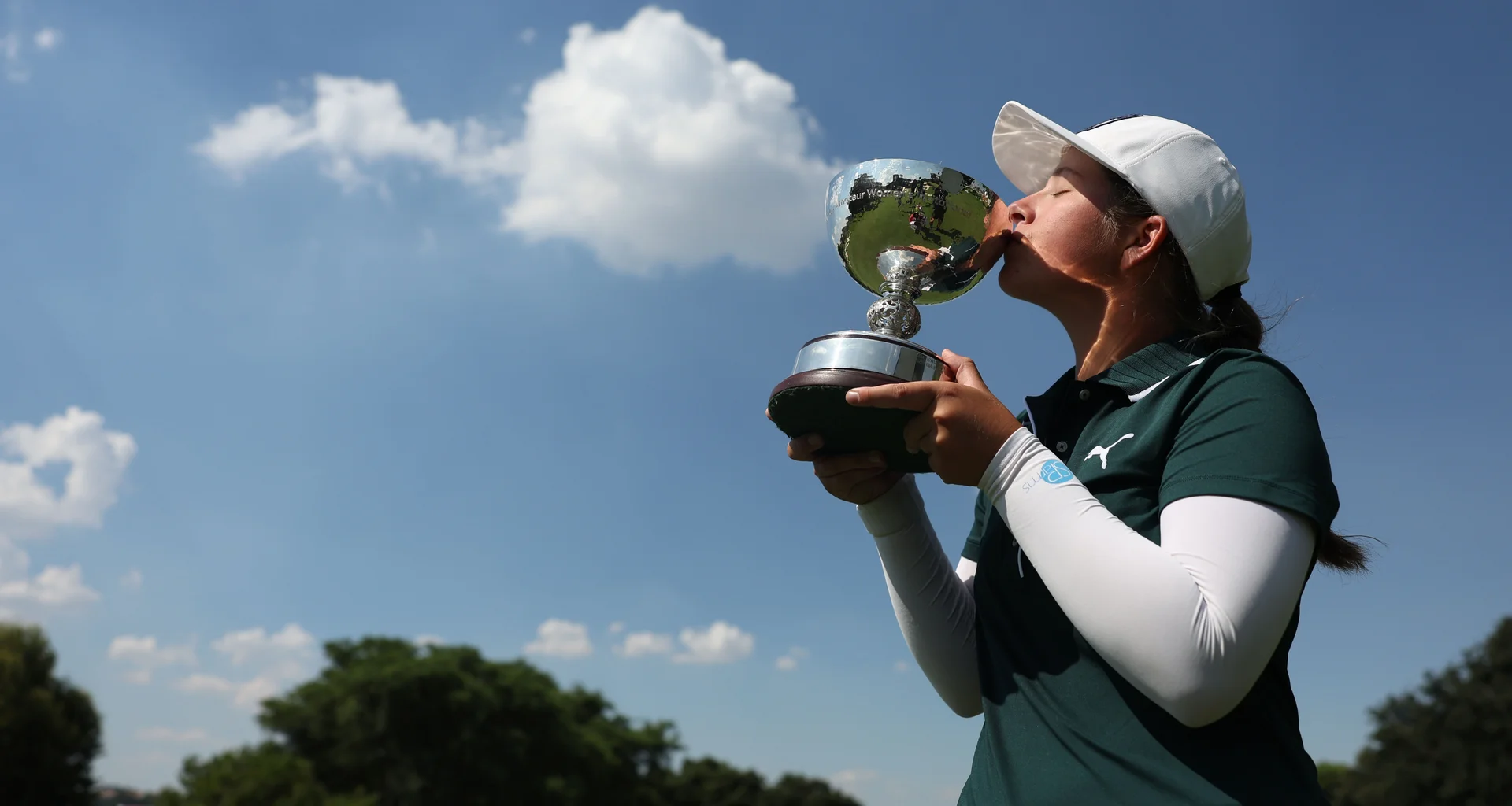 Lisa Coetzer celebrates with the Africa Amateur Women's Invitational trophy.
