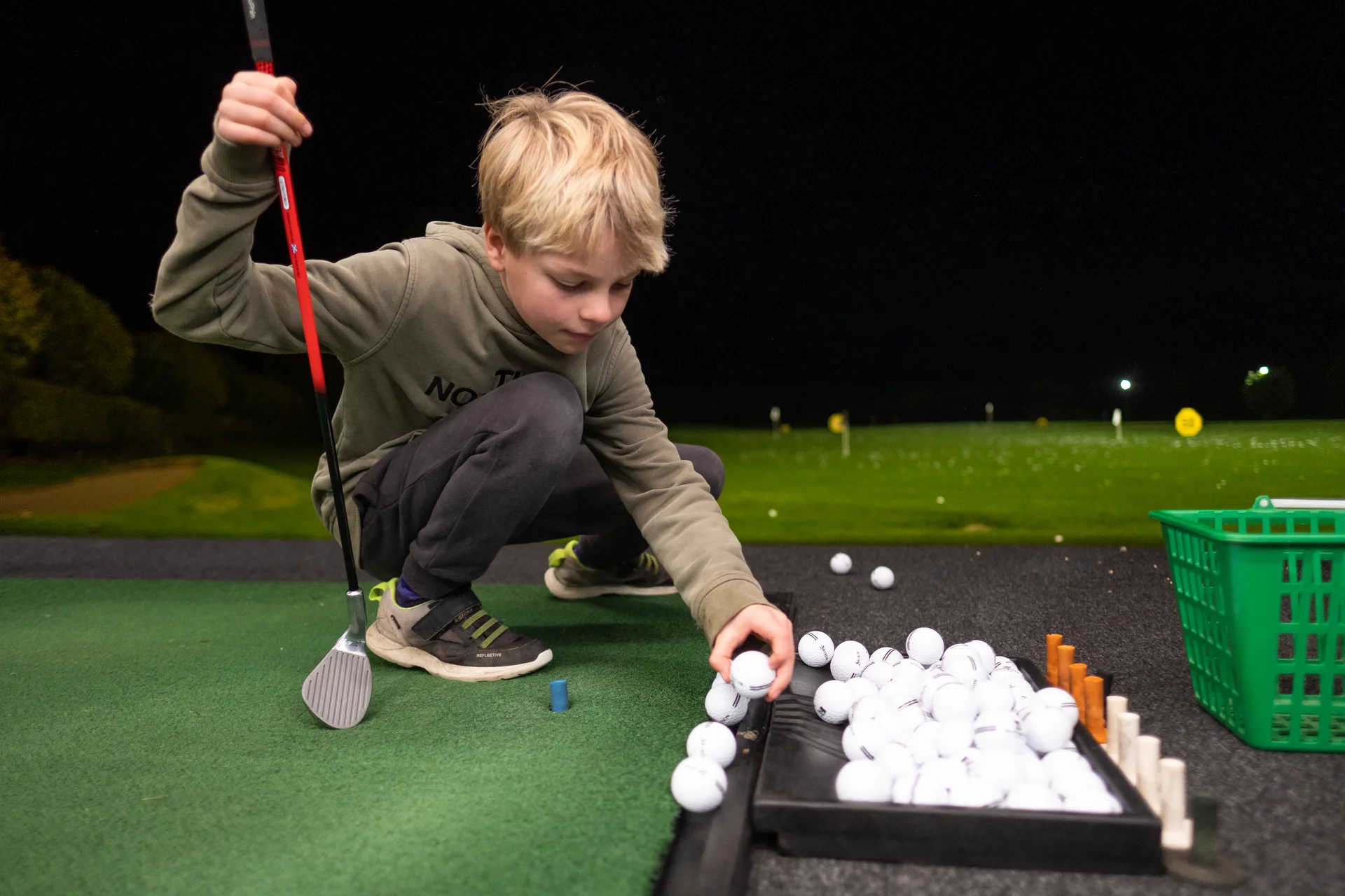Kid at driving range