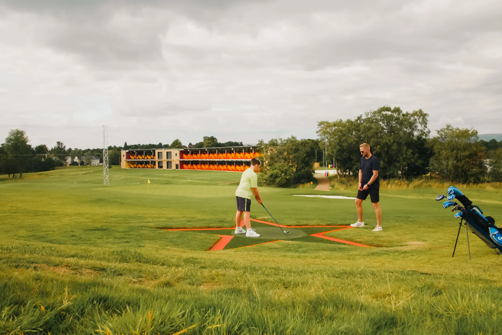 Golfers enjoying the Golf It! facility.
