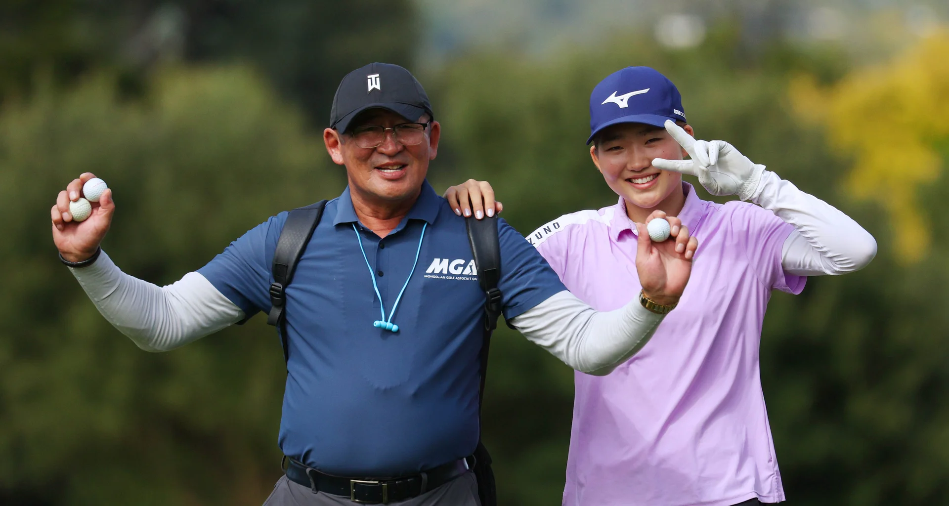 Yanjinlkham Batdelger of Mongolia (R) gestures during practice prior to The Women's Amateur Asia-Pacific Championship at Royal Wellington Golf Club.