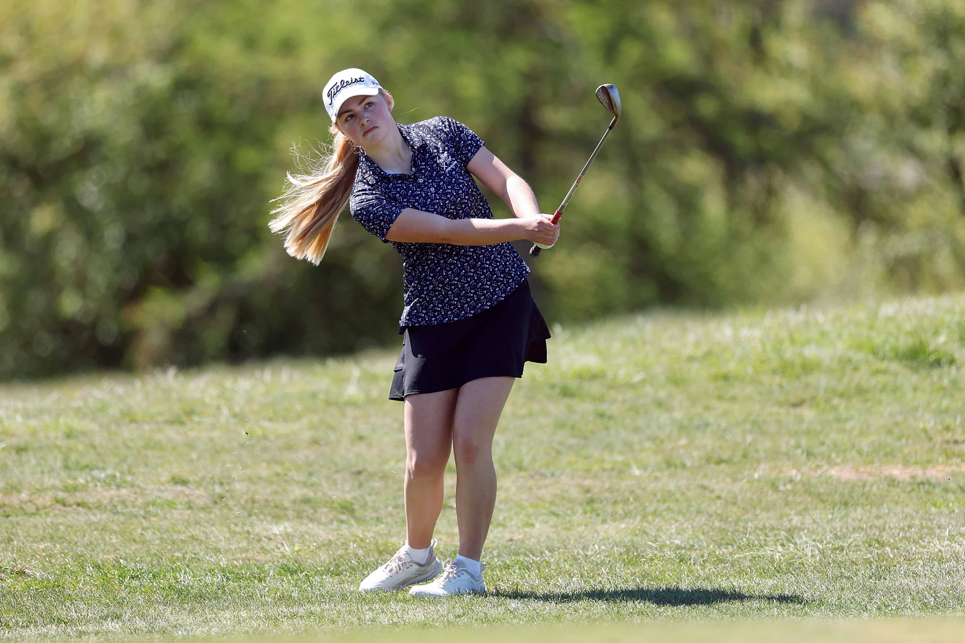 Carly McDonald plays an approach shot during the Girls' U16 Amateur Championship at Gog Magog.