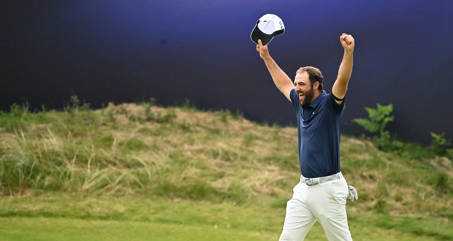 Scottie Scheffler celebrates on the 18th green after winning The 153rd Open at Royal Portrush.