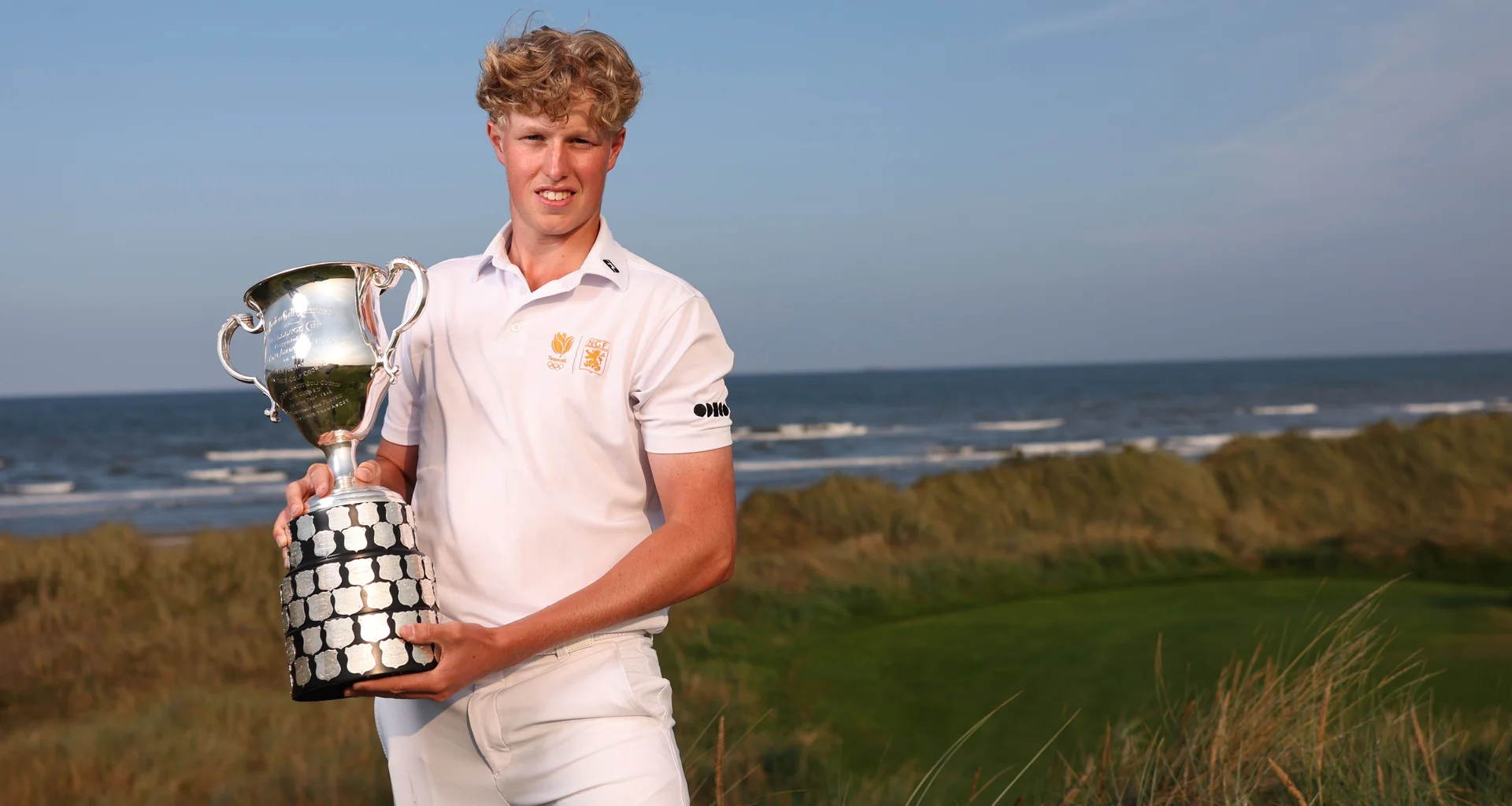 Guus Lafeber celebrates with the trophy after victory in the Boys' Amateur Championship at County Louth.