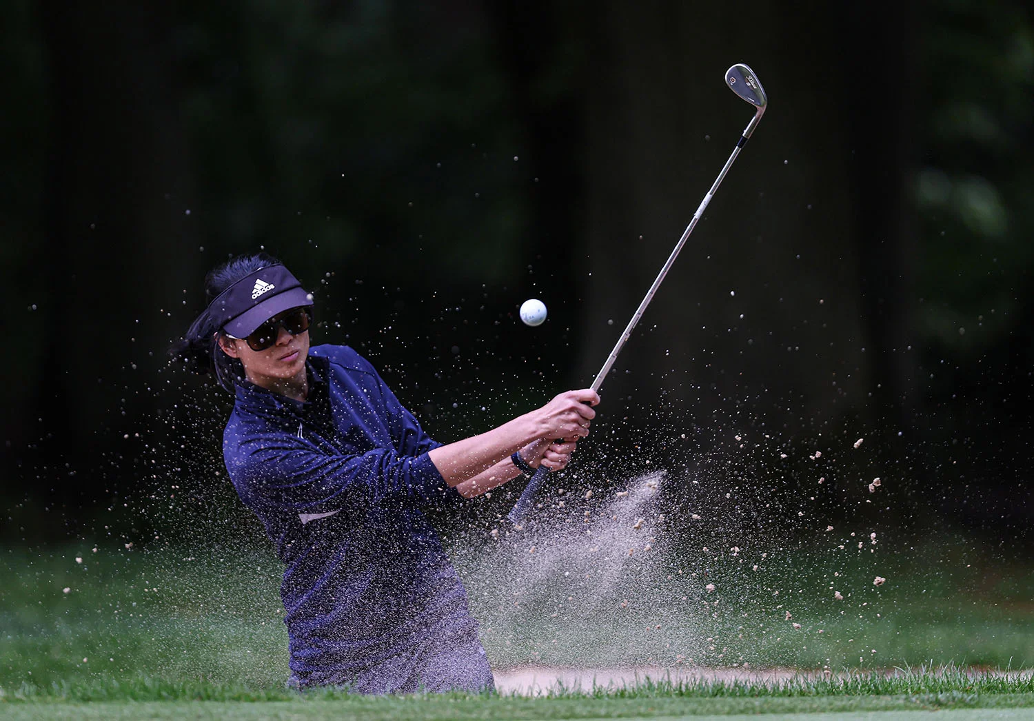 Michelle Lau plays a bunker shot at The G4D Open in 2025.
