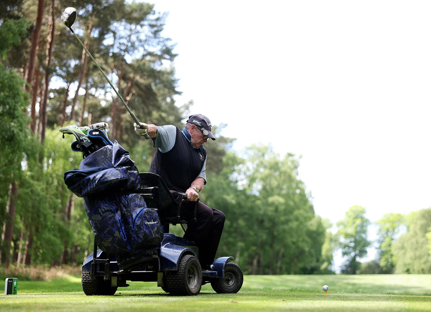 Terry Kirby plays a shot from his mobility device at The G4D Open in 2025.