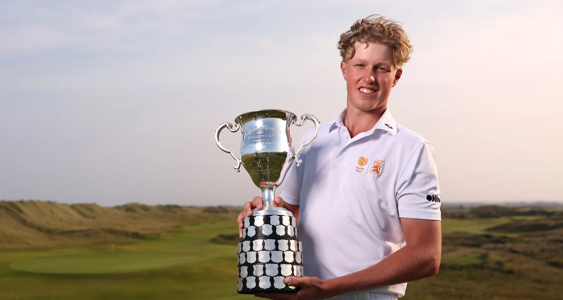 Guus Lafeber celebrates with the trophy after victory in the Boys' Amateur Championship at County Louth.