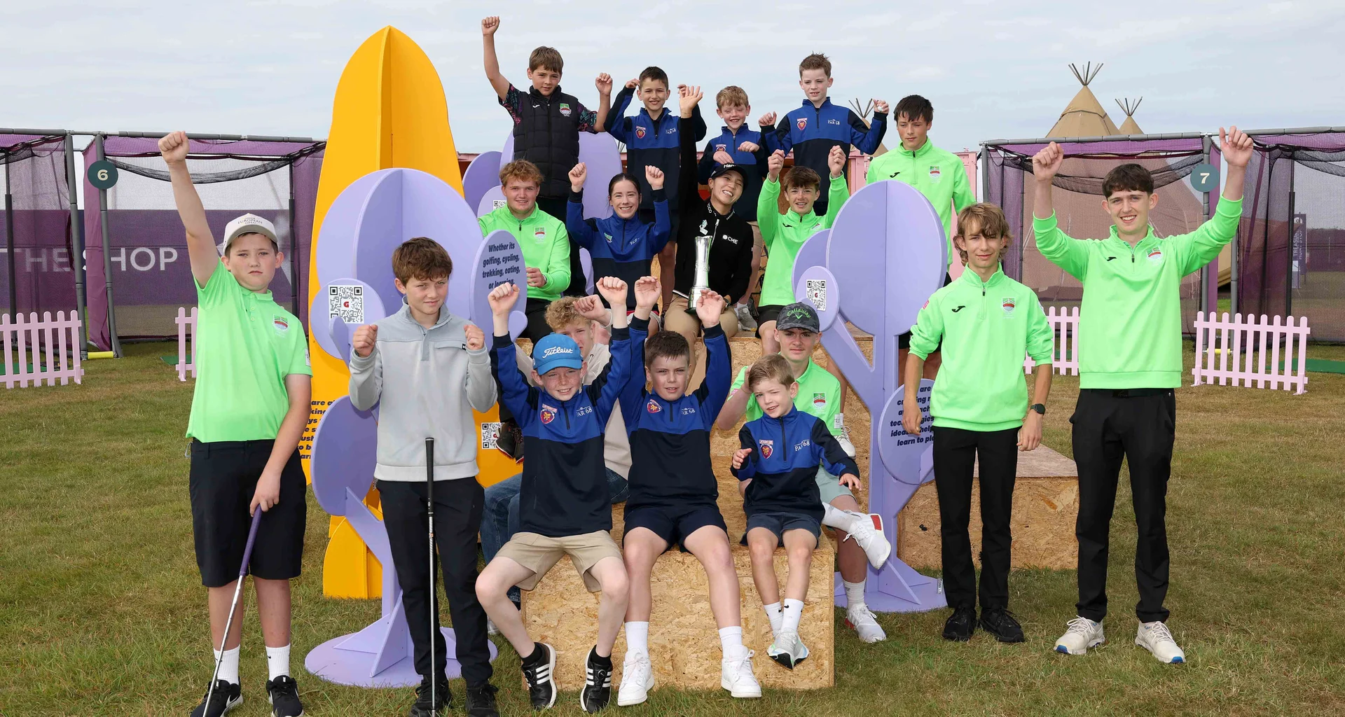 A group of children cheer in the 2025 AIG Women's Open festival area at Royal Portrush.