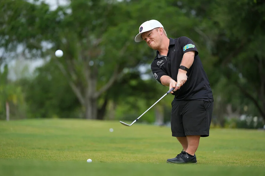 Joakim Björkman plays a shot with a wedge iron.