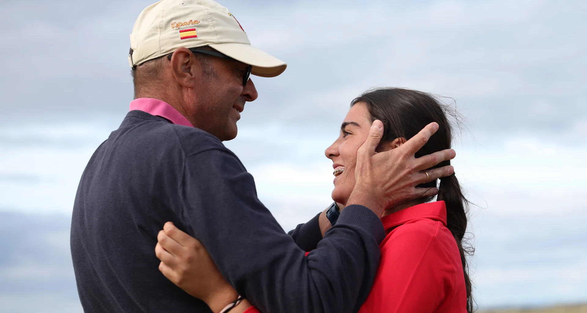 Marta Munoz celebrates with her dad after winning the Girls' Amateur Championship at Craigielaw.