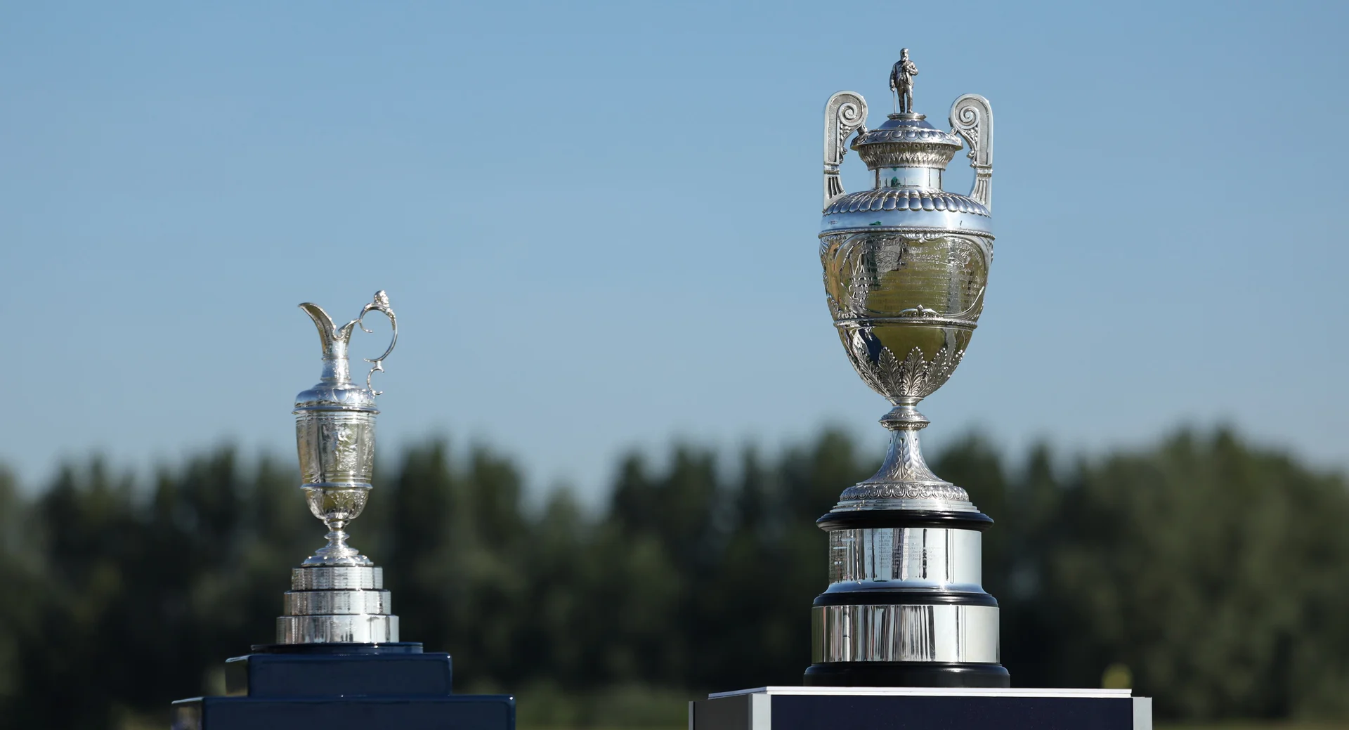 The Claret Jug and The Amateur Championship trophy.
