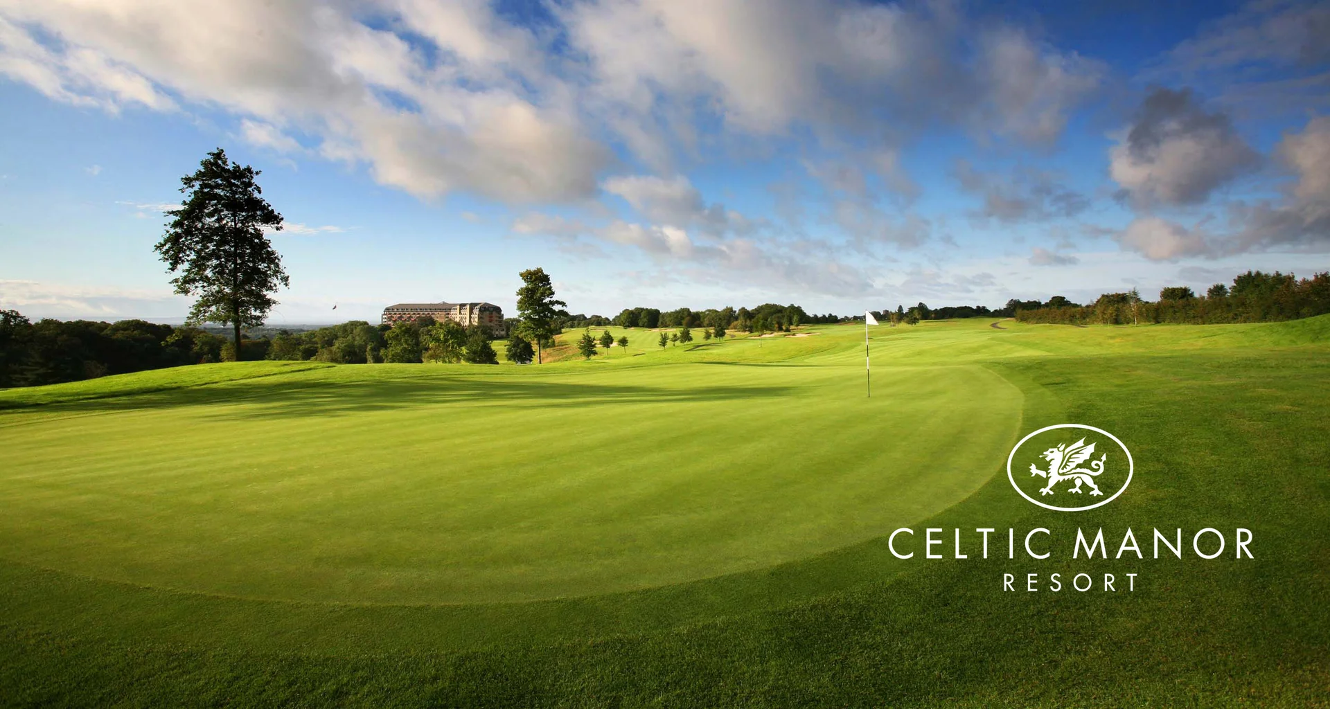 A general view of a green at Celtic Manor with the clubhouse in the background. The Celtic Manor Resort logo sits in the bottom right of the image.