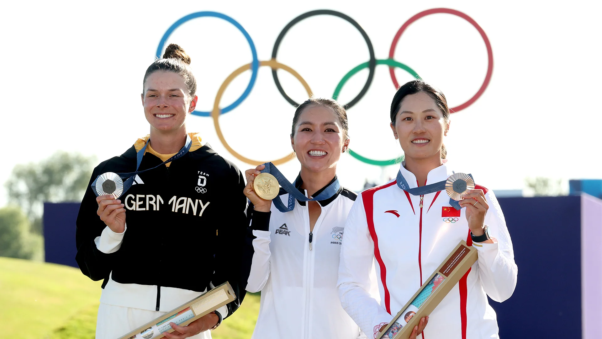 Esther Henseleit, Lydia Ko and Xiyu Janet Lin with their Olympic medals