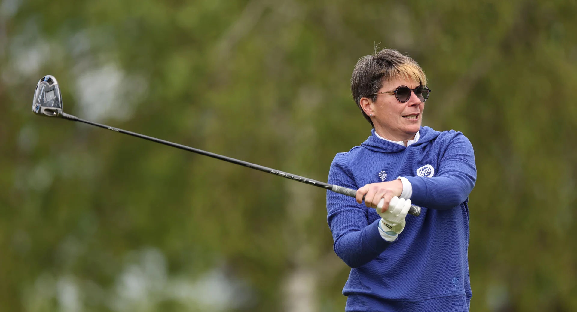 Aimi Bullock of England watches on after playing a driver shot.
