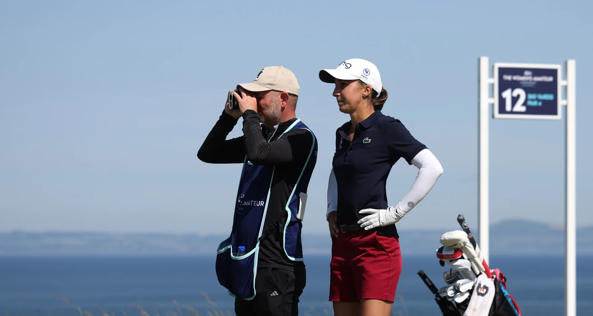 Valentine Delon of France looks on with her caddie during Day Four of the 2026 Women's Amateur Championship at Muirfield.