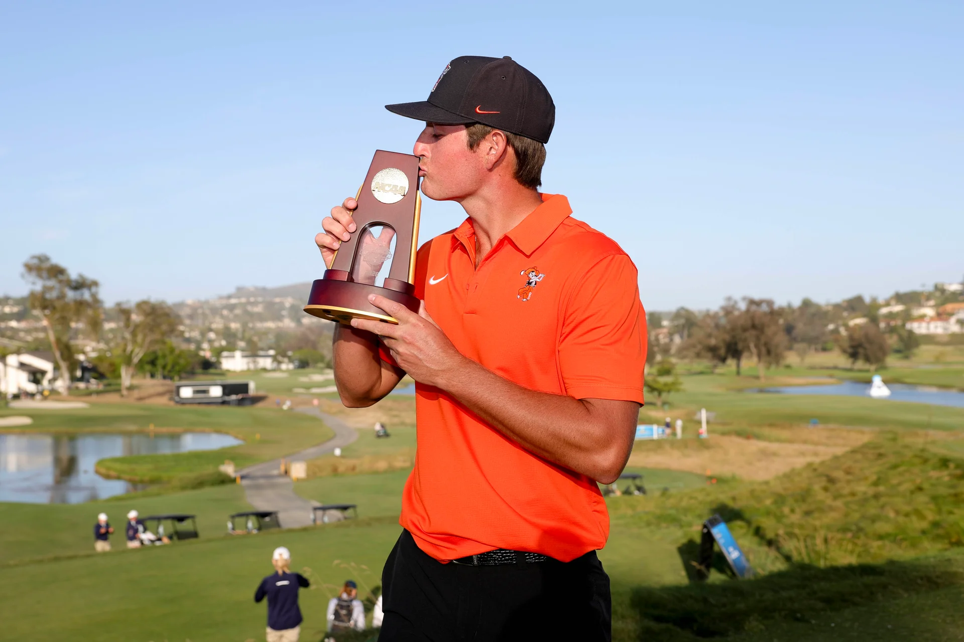 Preston Stout of the Oklahoma State Cowboys poses with the winners trophy after winning the NCAA Division 1 Men's Golf Individual Championship.