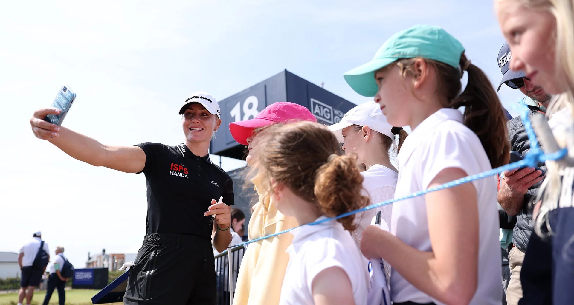 Charley Hull takes a selfie with a group of young fans at the AIG Women's Open.