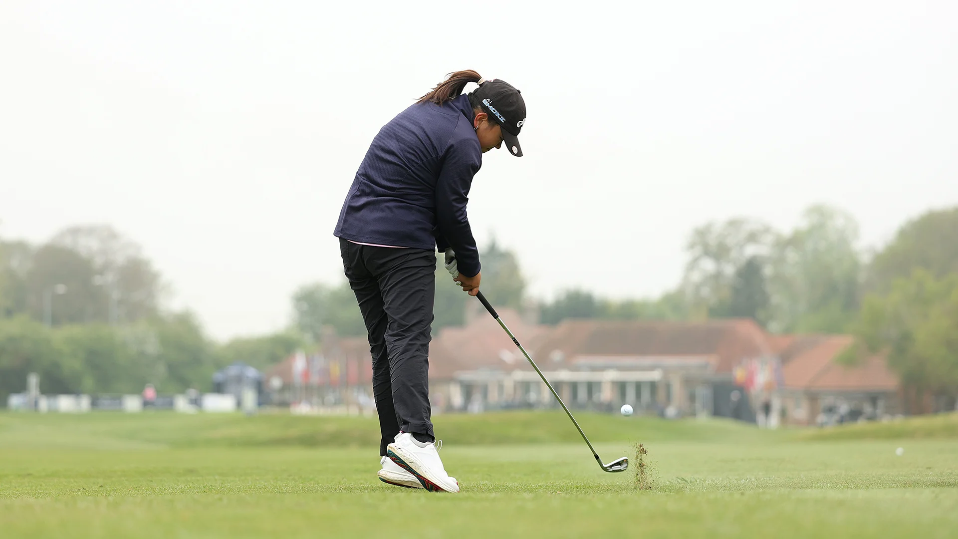 Sabrina Wong hits her approach to the 18th at Gog Magog