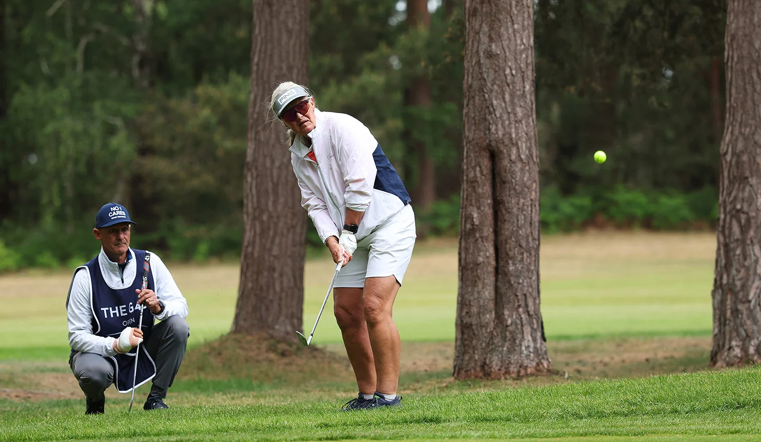 Mett Havnaas plays an approach shot under the guidance of her caddy at The G4D Open in 2025