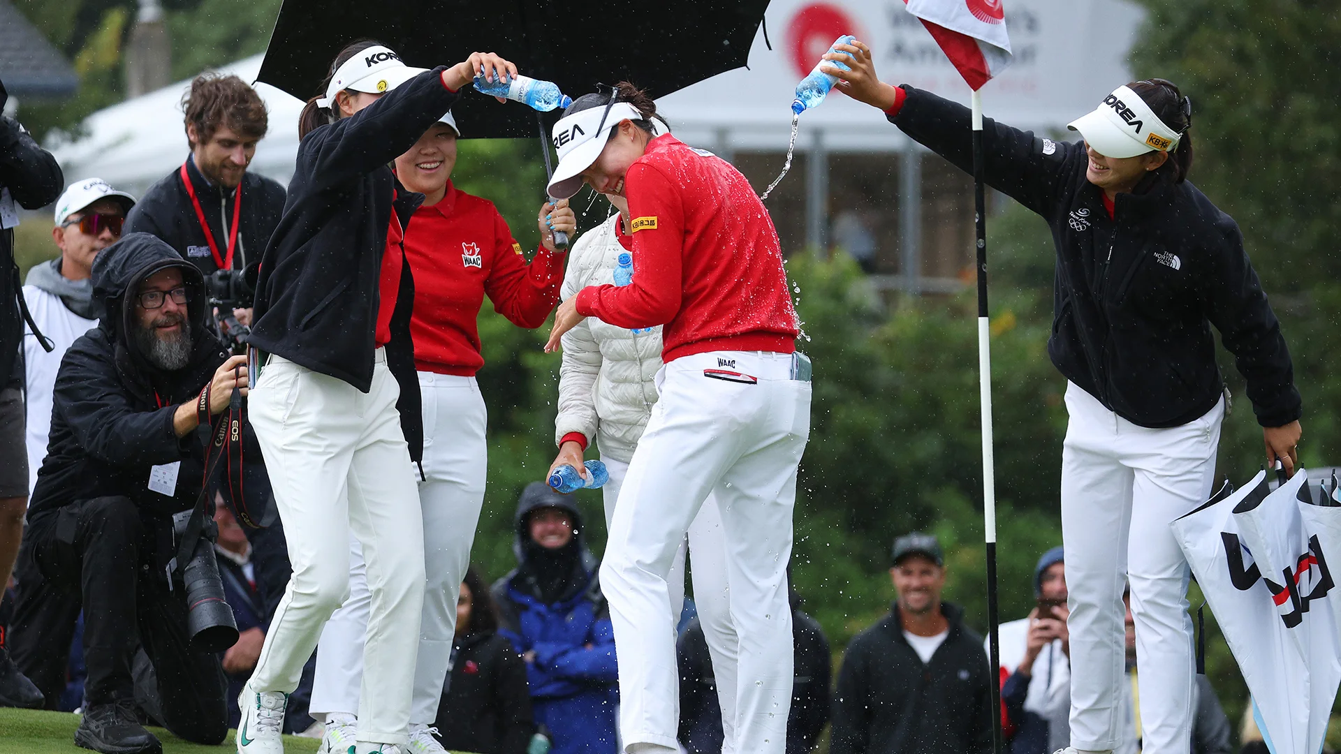 Yunseo Yang gets a celebratory soaking after winning by eight shots