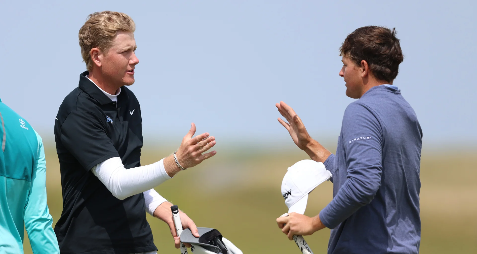 Luke Poulter and Daniel Bennett shake hands after their opening round in the 2026 Amateur Championship.