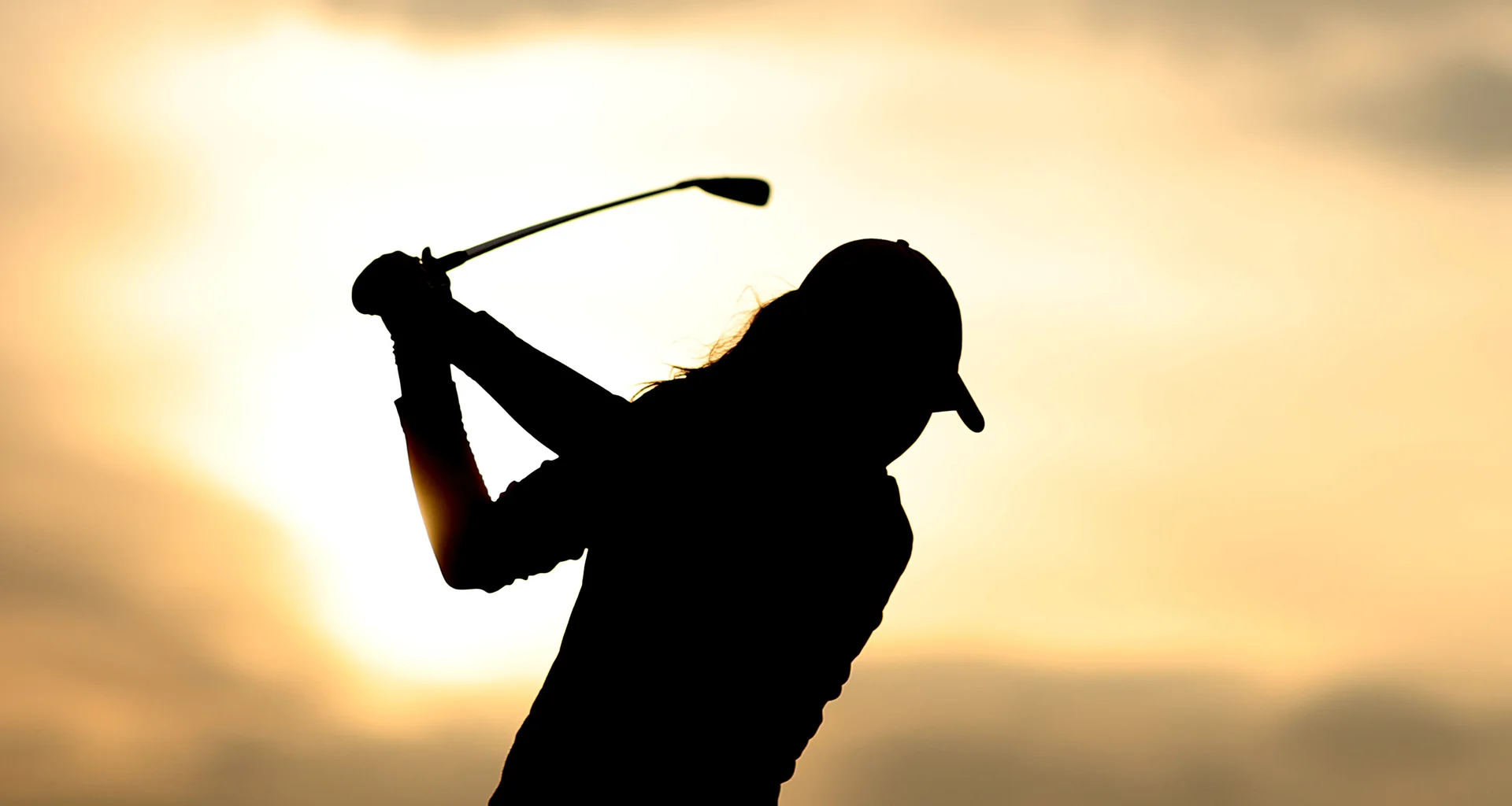 A silhouette as Hanna Jelander of Sweden tees off on the second hole during day two of The R&A Girls' Amateur Championship at Conwy Golf Club on August 12, 2025.
