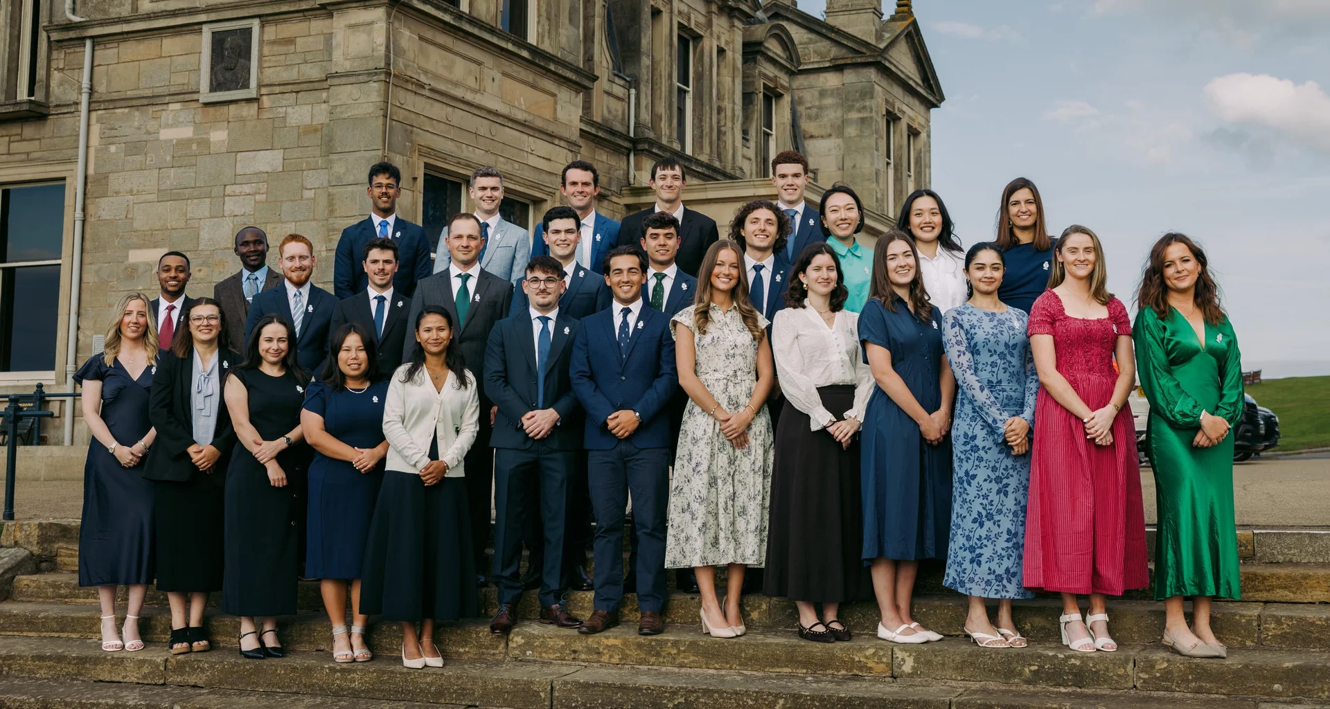 The R&A Scholars stand together for a group photograph.