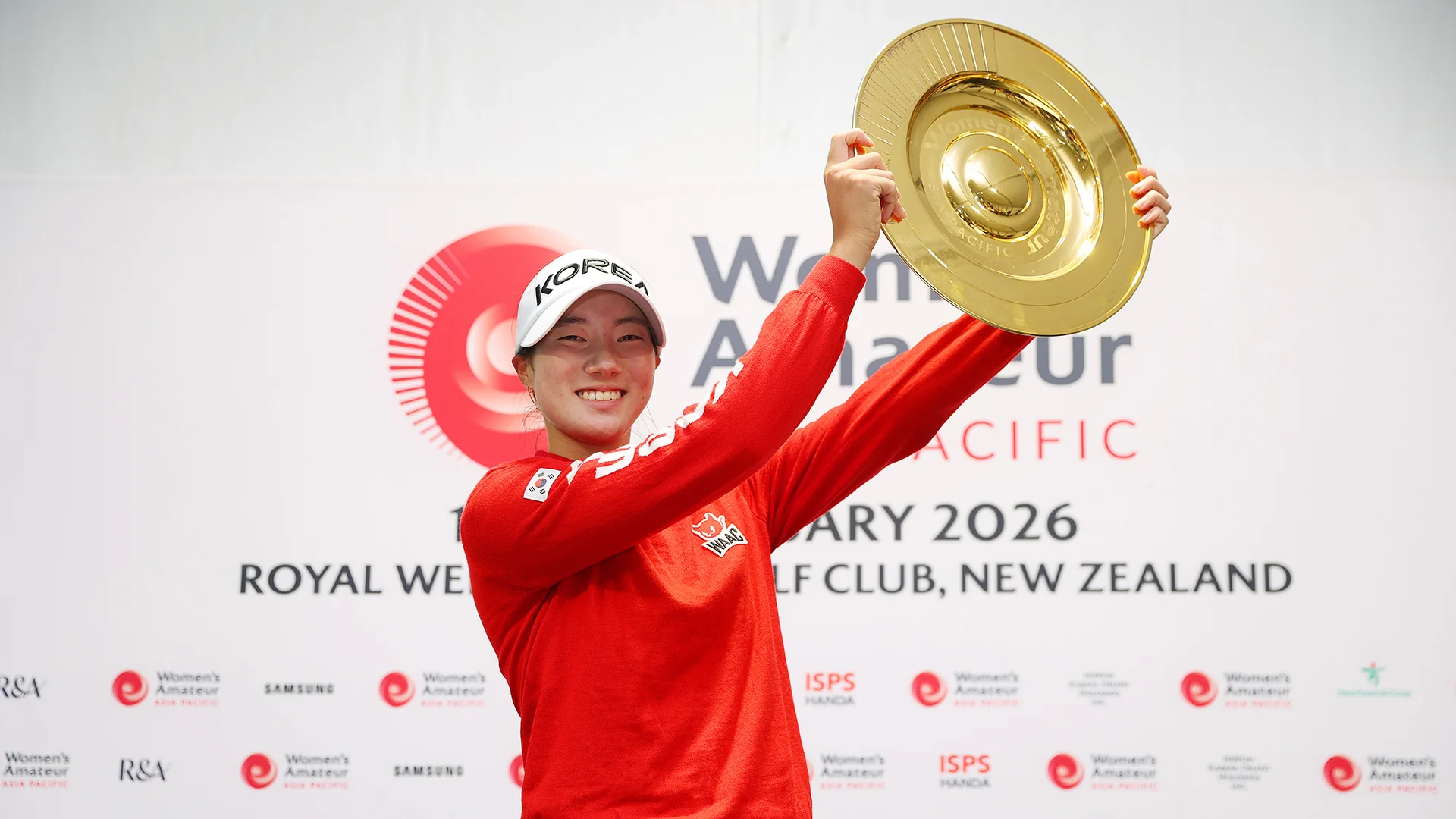 The newly crowned WAAP champion lifts her trophy at Royal Wellington