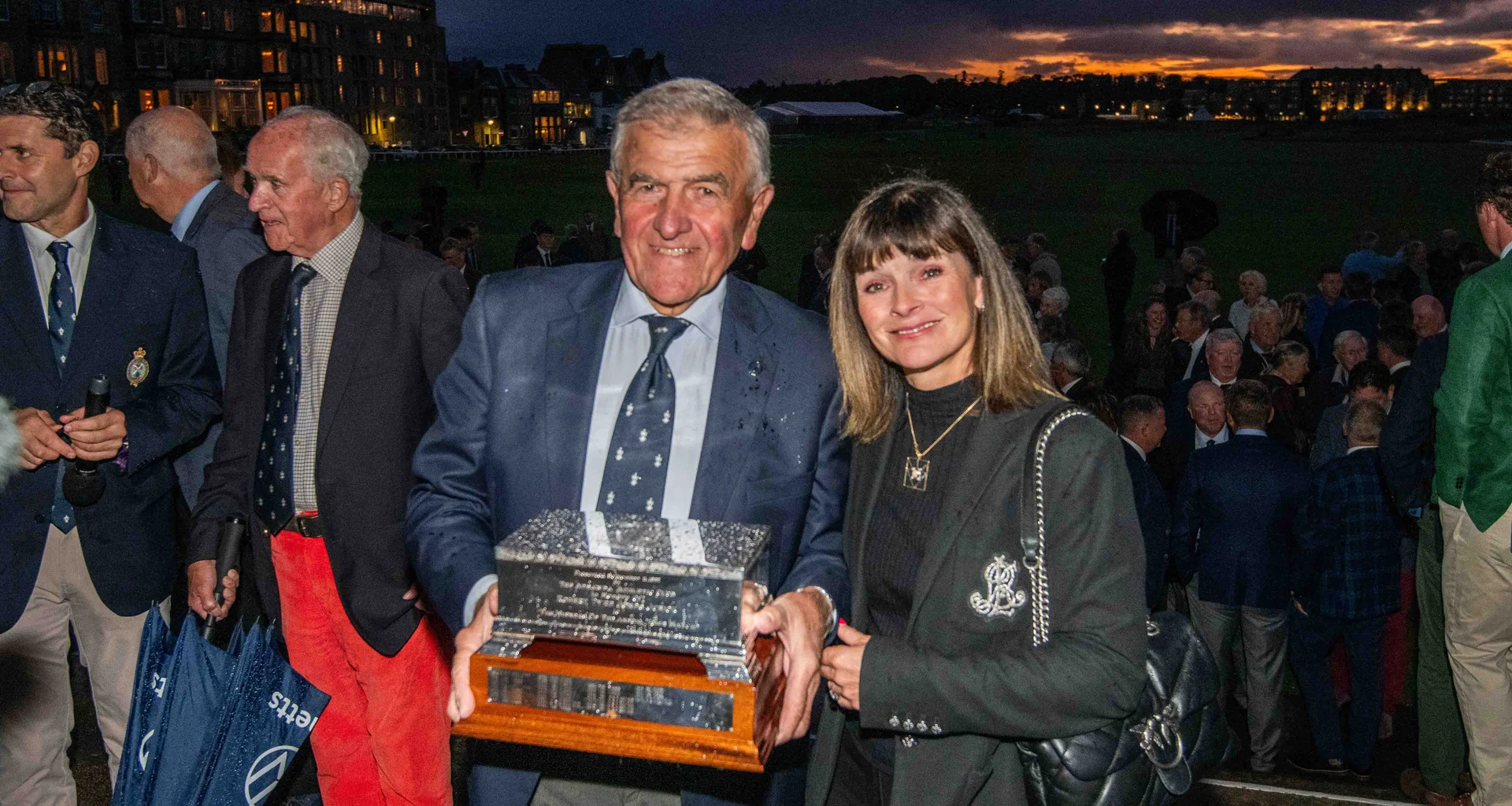 Ian Pattinson, Captain of The Royal and Ancient Golf Club of St Andrews, is presented with the Bobby Jones Casket by Susan Bor, Captain of St Regulus Ladies Golf Club at the 2025 Town Match in St Andrews.