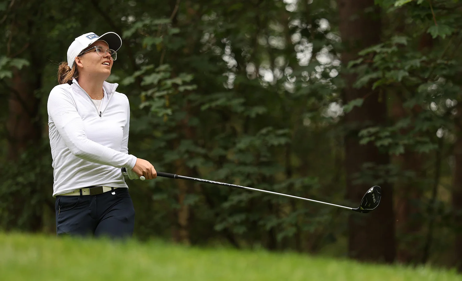 Daphne van Houten watches her ball after playing an approach shot.