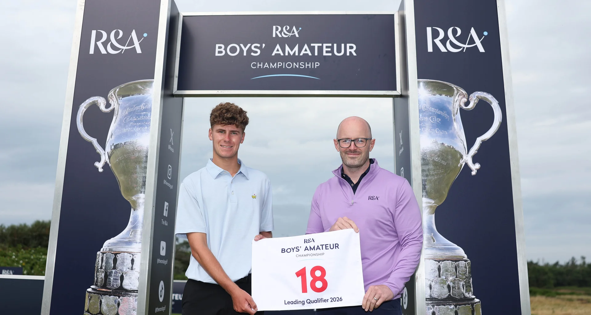 Cole Self of England receives an award for leading qualifier from Craig Brodie (Chairman of the Championship) at The Boys' Amateur Championship at Gailes Links.