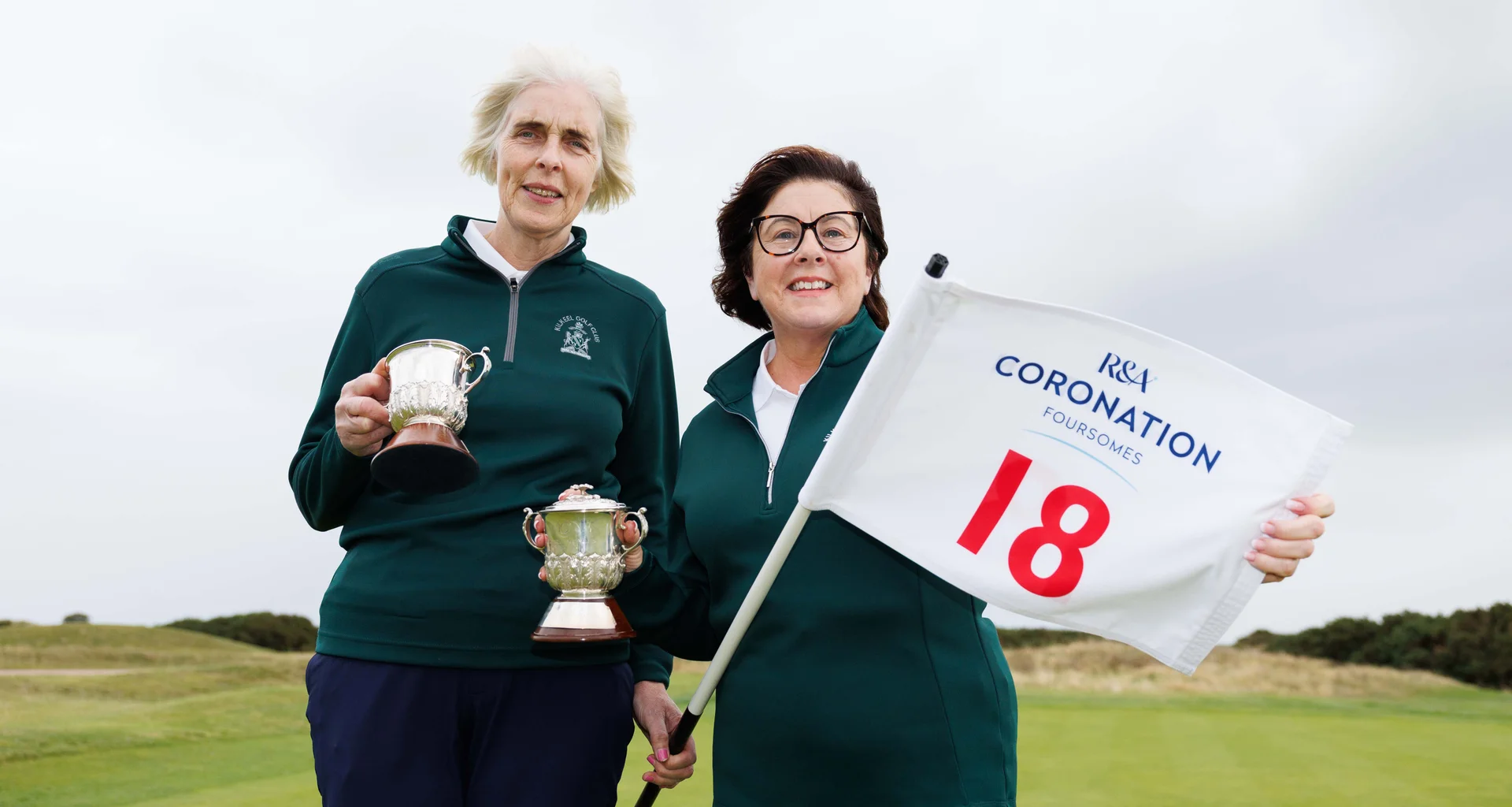 Marie Walls and Michelle Hughes celebrate their success in the 2025 Coronation Foursomes Grand Final in St Andrews.