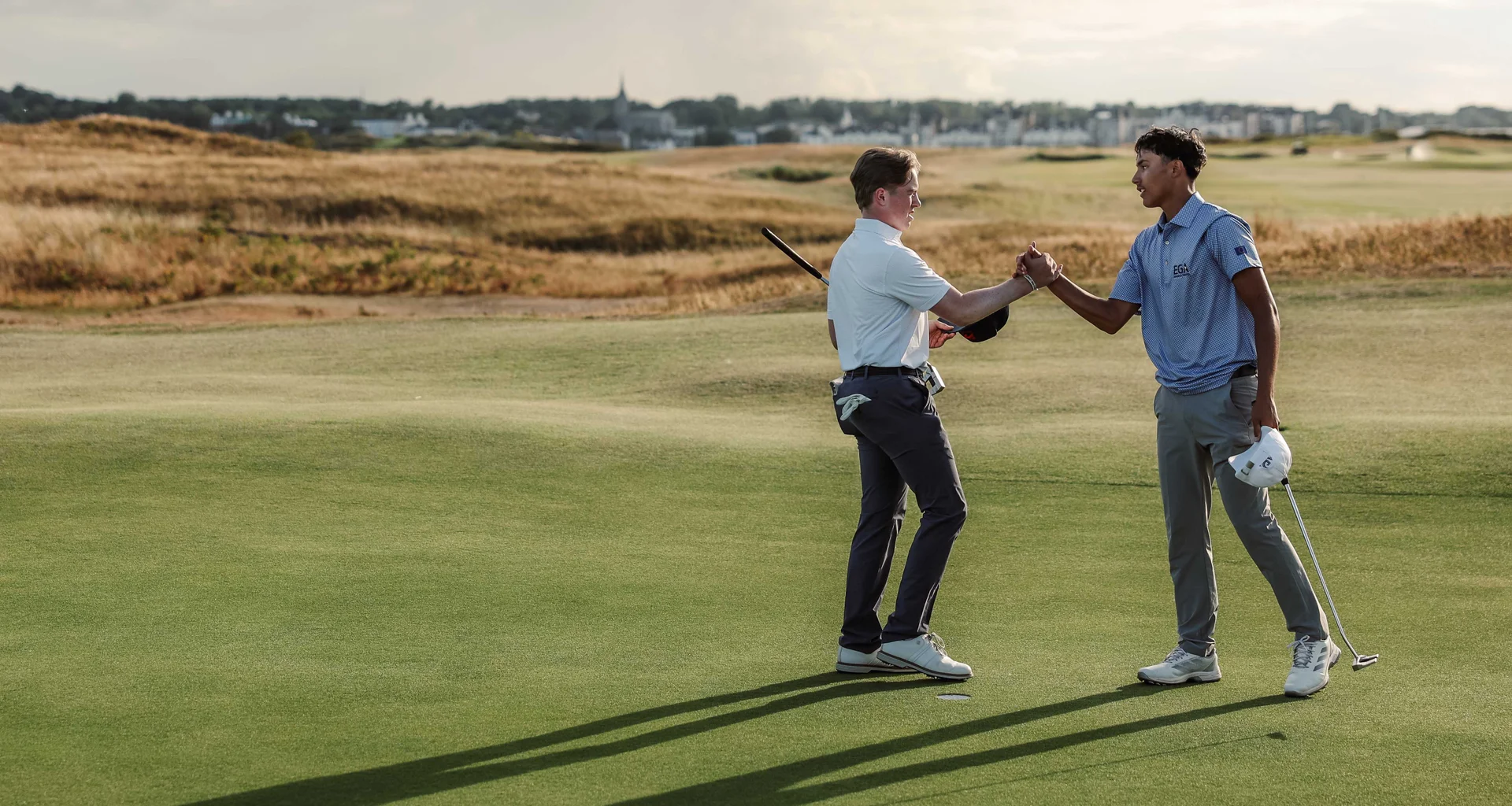 Tao Pemerika of Continent of Europe and Harry O'Hara of Team Great Britain and Ireland shake hands after their singles match at the Jacques Leglise Trophy.